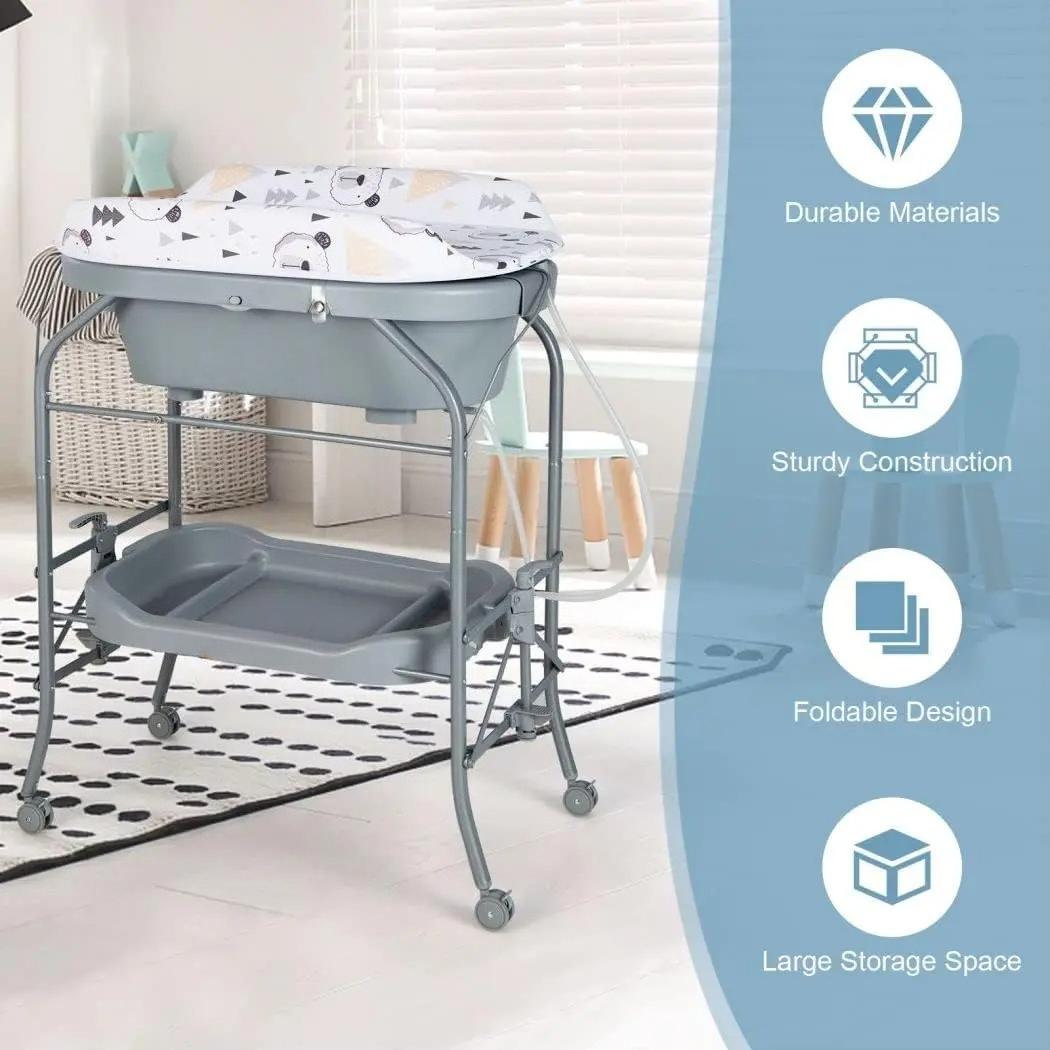 `4‑in‑1 Folding Baby Changing Table, Portable Infant Nursery Station with Built‑in Bath Tub, 4 Universal Rolling Wheels, PVC Changing Pad & Storage Tray, Newborn Massage Diaper Organizer Table`